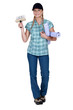 Decorator with rolls of wallpaper