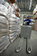 Photo: Forklift operator uniform and helmet at work in warehouse Forklift operator uniform and helmet at work in warehouse