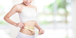 Woman smile measuring shape of waist