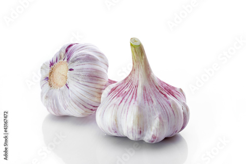Photo: Garlics on white background Garlics on white background