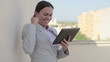 Video: Successful businesswoman with tablet computer, outdoors Successful businesswoman with tablet computer, outdoors