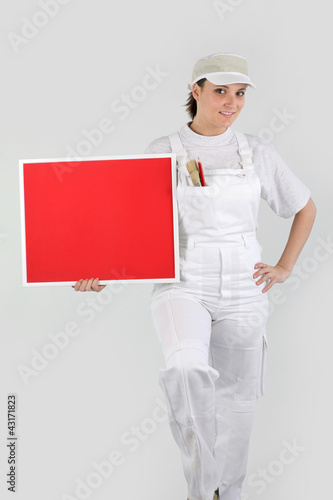 Foto: Decorator with a blank board Decorator with a blank board