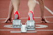 Detailed view of a sprinter wearing sprinting shoes with spikes,