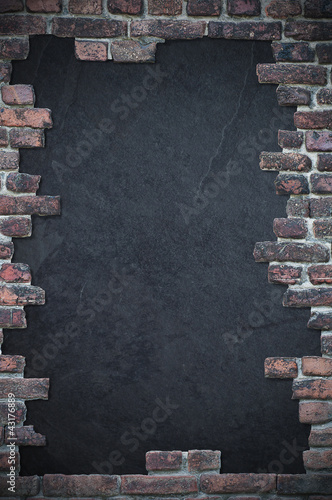 Photo: brick stone wall with dark text space brick stone wall with dark text space