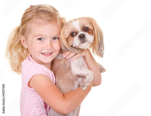 Photo: young girl holding pet dog young girl holding pet dog