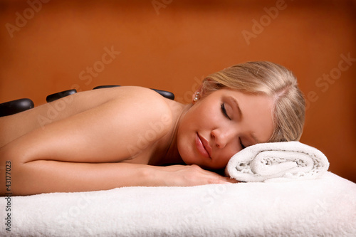 Photo: Portrait of young beautiful woman in spa environment. Portrait of young beautiful woman in spa environment.