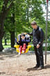 Father pushing disabled boy in special needs swing