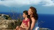 Family happy smiling  in cliff blue sea background