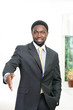 Photo: Smiling african businessman offering handshake Smiling african businessman offering handshake