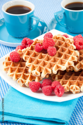 Photo: Coffee and homemade waffles with raspberries for breakfast Coffee and homemade waffles with raspberries for breakfast