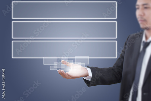 Photo: Businessman holding Button on the whiteboard. Businessman holding Button on the whiteboard.