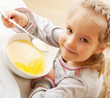 Photo: Little girl eating soup Little girl eating soup