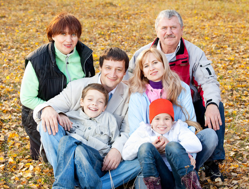 Photo: Big family in autumn park Big family in autumn park