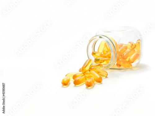 Photo: Fish oil capsules and container Fish oil capsules and container