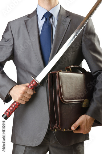 Photo: Businessman with sword on white Businessman with sword on white
