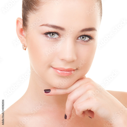 Photo: Portrait of the young woman isolated on white background Portrait of the young woman isolated on white background