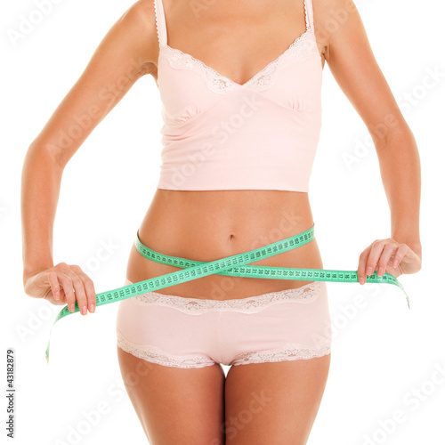 Photo: happy young woman with measure tape happy young woman with measure tape