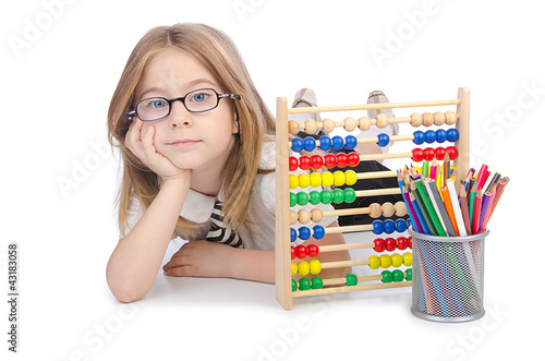 Foto: Girl with abacus on white Girl with abacus on white