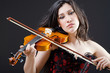 Female violin player against background