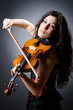 Female violin player against background