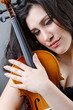 Female violin player against background