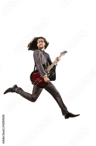 Photo: Guitar player in business suit on white Guitar player in business suit on white
