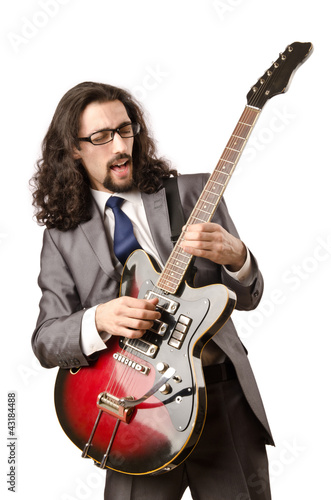 Photo: Guitar player in business suit on white Guitar player in business suit on white