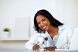 Photo: Charming young female using a microscope Charming young female using a microscope