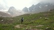Young boy walking in the high Alps mountains