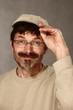man with baseball cap greeting friendly