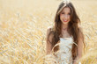 Foto: Beautiful woman in the wheat field Beautiful woman in the wheat field
