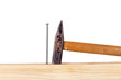 Hammer and nail with wooden board