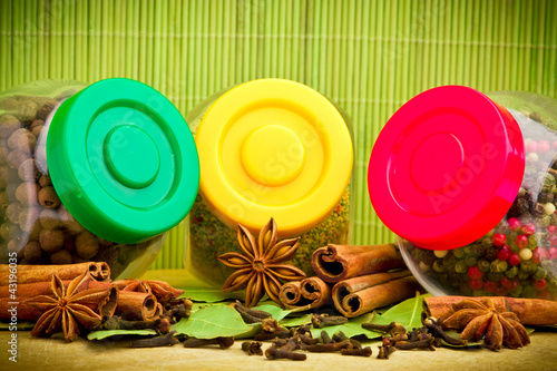 Photo: Pack of several spices and herbs in glass jars Pack of several spices and herbs in glass jars