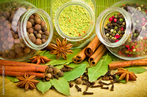 Photo: Pack of several spices and herbs in glass jars Pack of several spices and herbs in glass jars