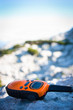 Closeup of a walkie-talkie laid aside on a rock 