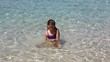 beautiful little girl playing in ibiza beach on vacation