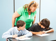 Photo: Teacher Supervises Testing Teacher Supervises Testing