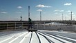 Worker on a top of a huge oil tank