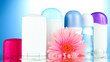 deodorant botttles with flower on blue background