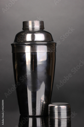 Photo: Cocktail shaker on grey background Cocktail shaker on grey background