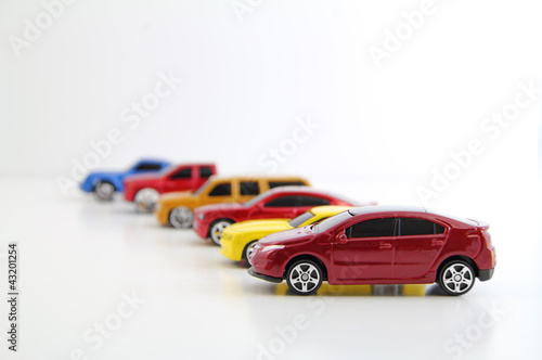 Photo: Row of cars with electric car in focus. Row of cars with electric car in focus.