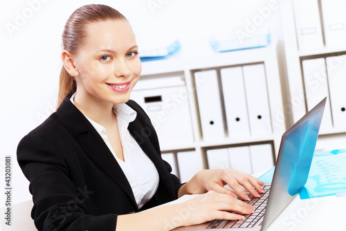 Photo: Business woman in office Business woman in office
