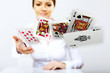 Young woman showing poker cards