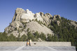 Photo: A man and woman at the Grand Terrace view of Mount Rushmore National Memorial, South Dakota A man and woman at the Grand Terrace view of Mount Rushmore National Memorial, South Dakota