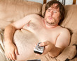 Fat lazy guy watching the TV