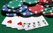 Cards and chips for poker on green table
