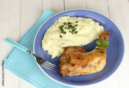 Photo: roasted chicken leg with mashed potato in the plate roasted chicken leg with mashed potato in the plate