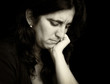 Vintage monochromatic portrait of a very sad woman