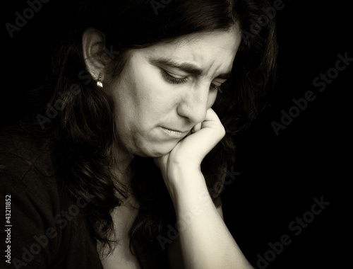 Photo: Vintage monochromatic portrait of a very sad woman Vintage monochromatic portrait of a very sad woman