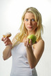 Sexy blond girl with apple and donut